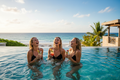 Blonde twins at tropical pool with ocean views